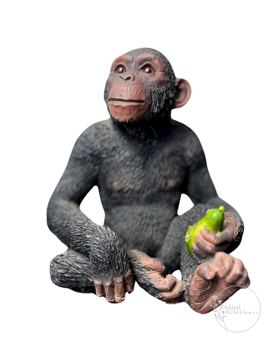 Sitting Chimpanzee Figurine with Pear